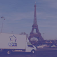 "white delivery van driving past the eiffel tower. the van is sharp, rest is motion blurred.view more similar images:"